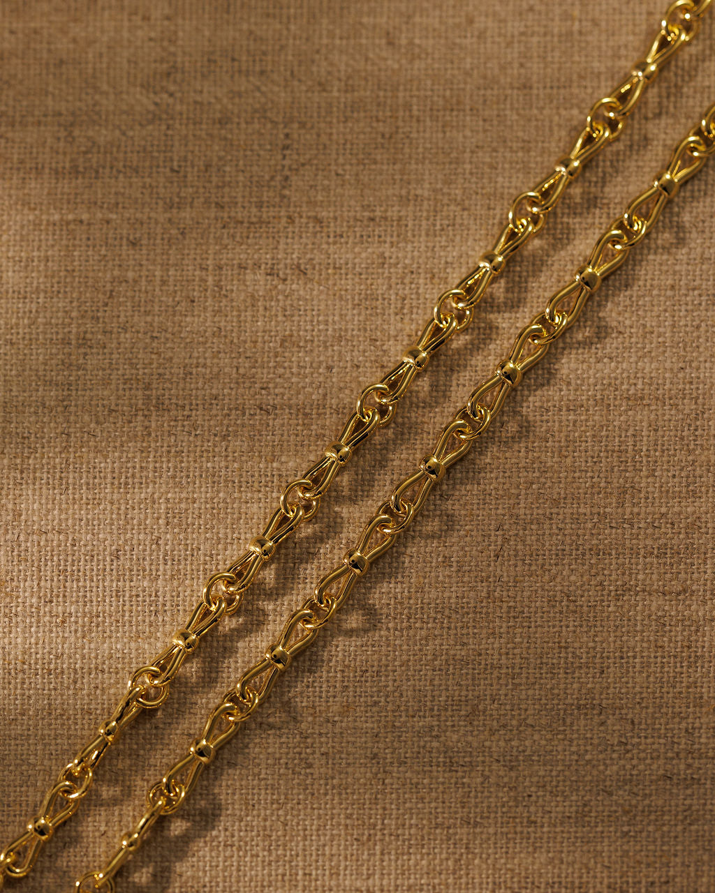 EADIE gold bow tie link detail