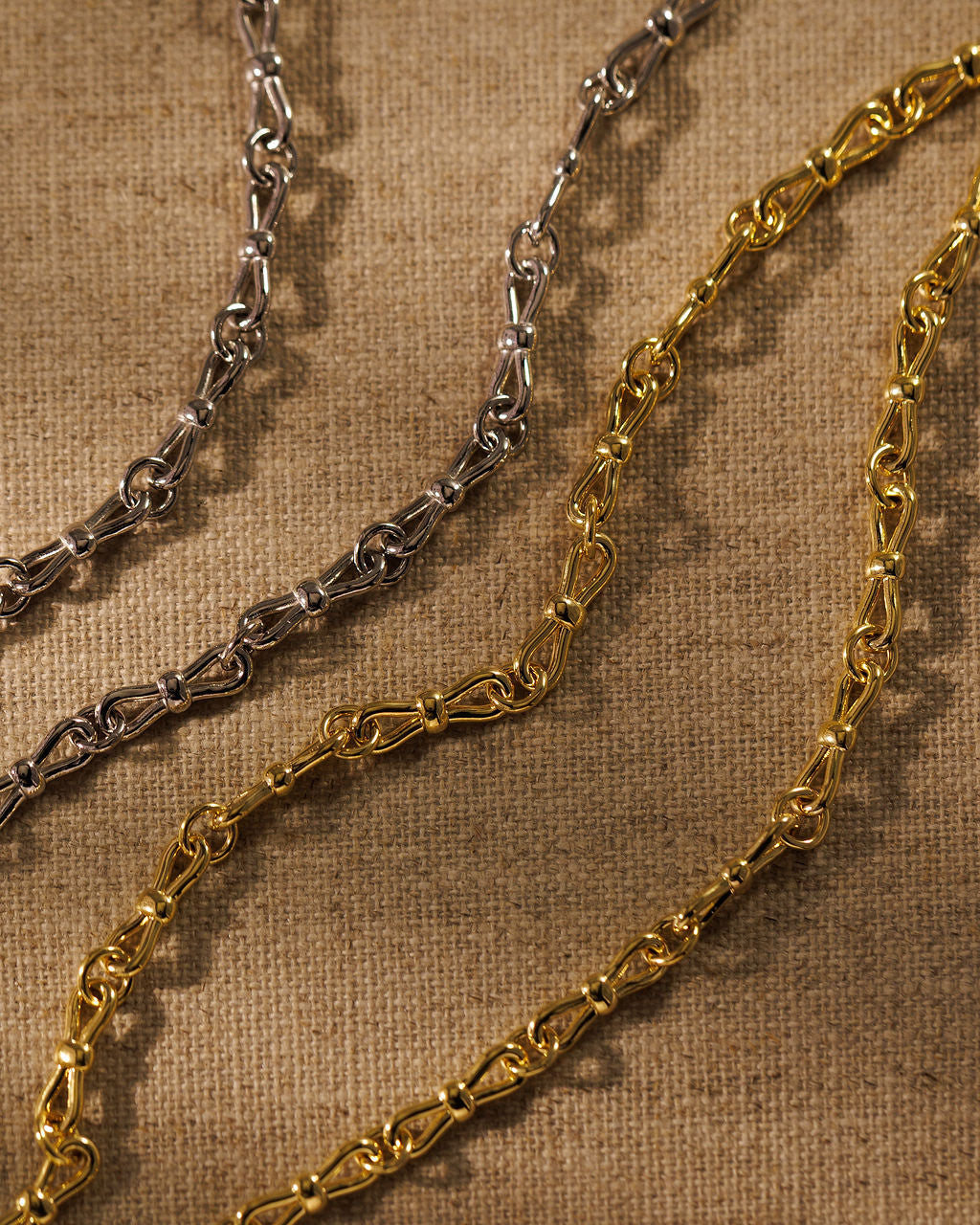 EADIE bow tie chains in silver and gold