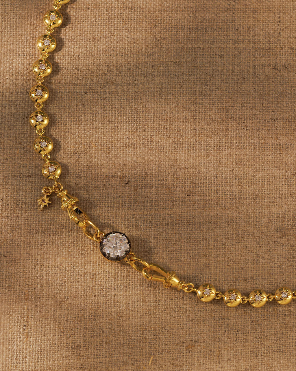 ODETTE round moissanite extender set into the LULU tennis necklace