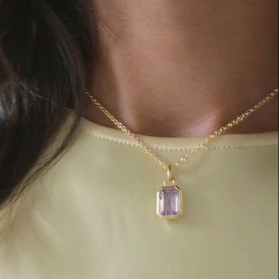 Lumi 18ct gold plated emerald cut pink amethyst pendant styled on an ivy gold chain necklace