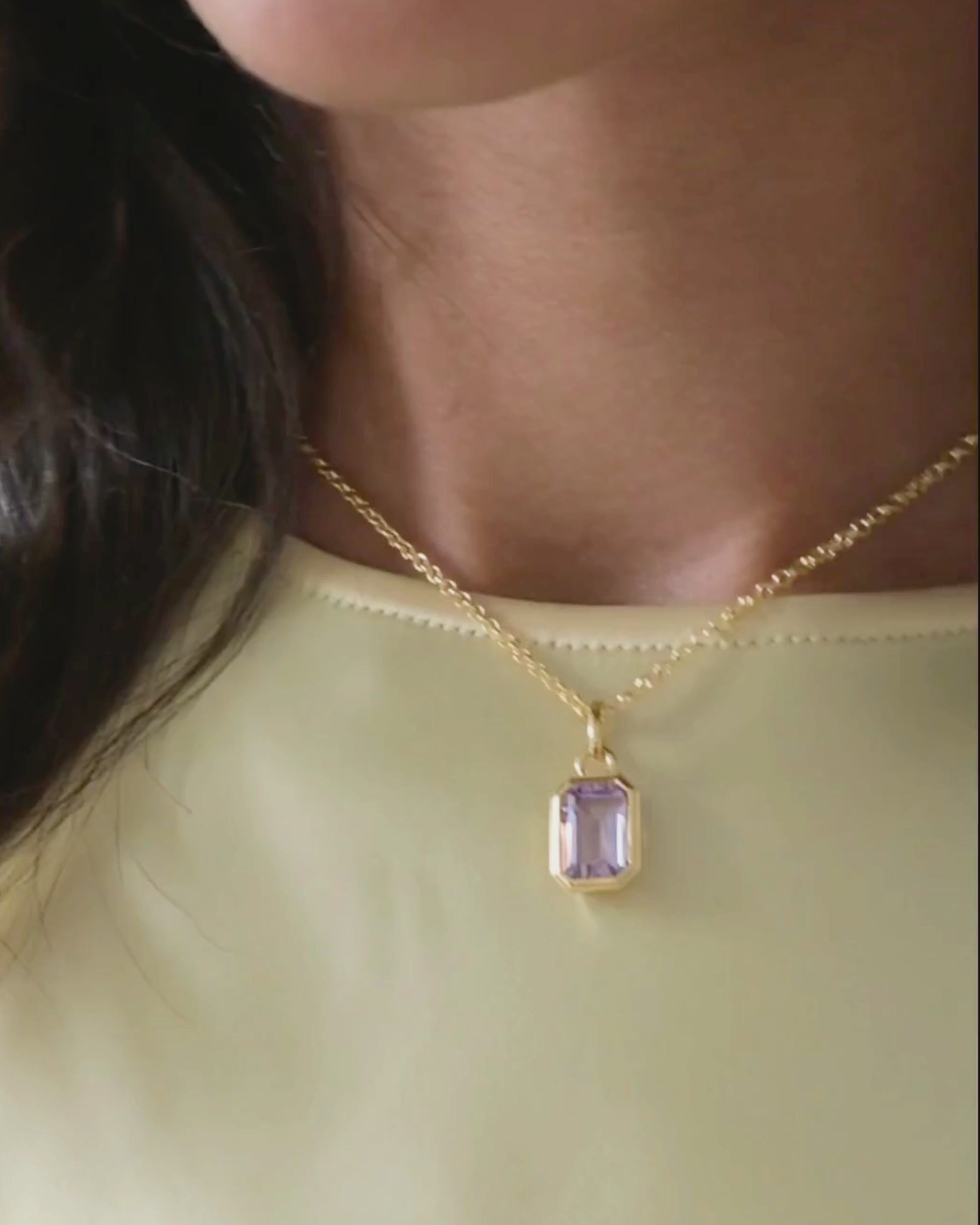 Lumi 18ct gold plated emerald cut pink amethyst pendant styled on an ivy gold chain necklace