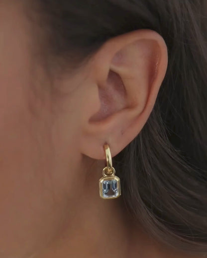 Cara reversible 18ct gold and silver hoop earrings with Lumi emerald cut blue topaz drop charm