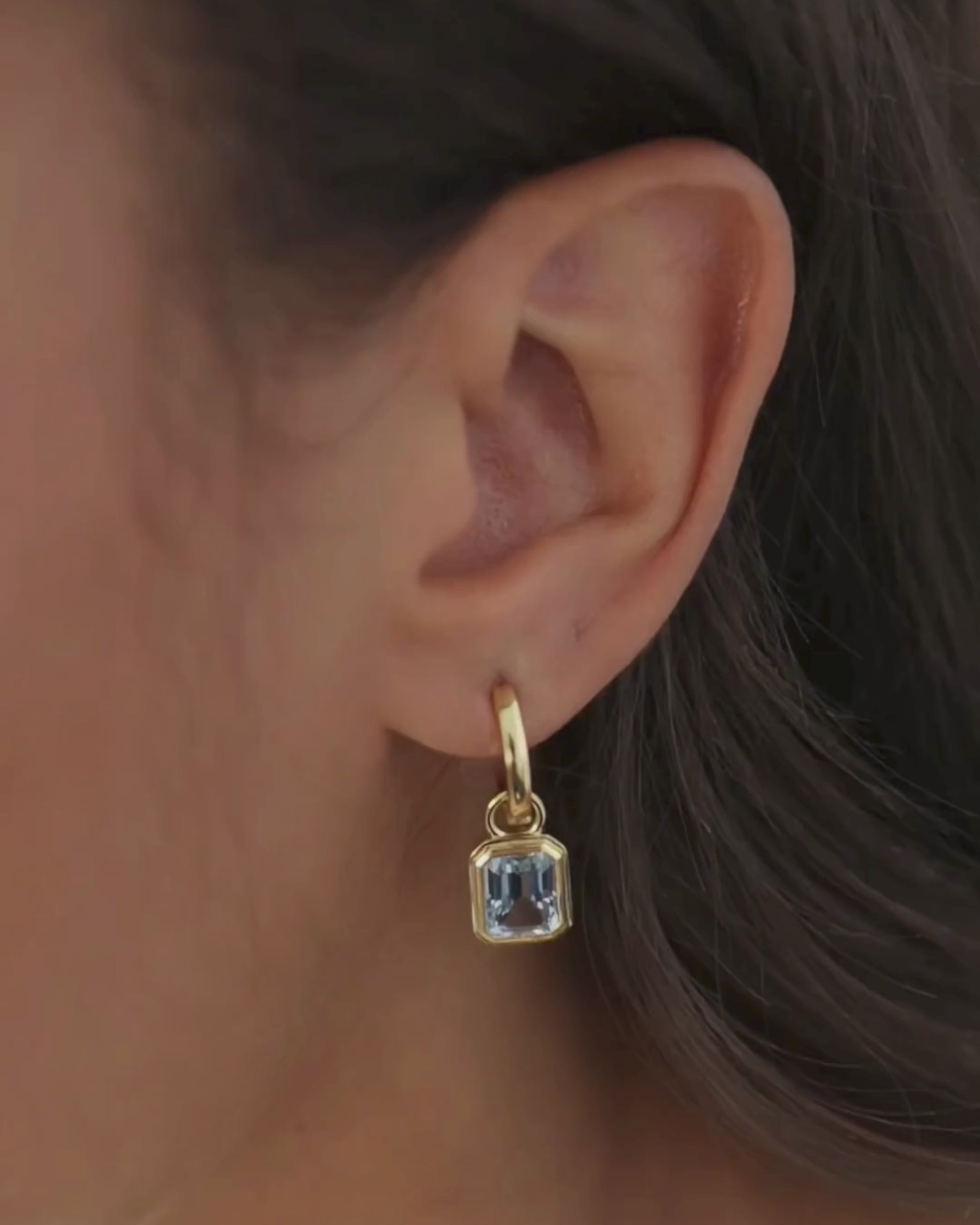 Cara reversible 18ct gold and silver hoop earrings with Lumi emerald cut blue topaz drop charm