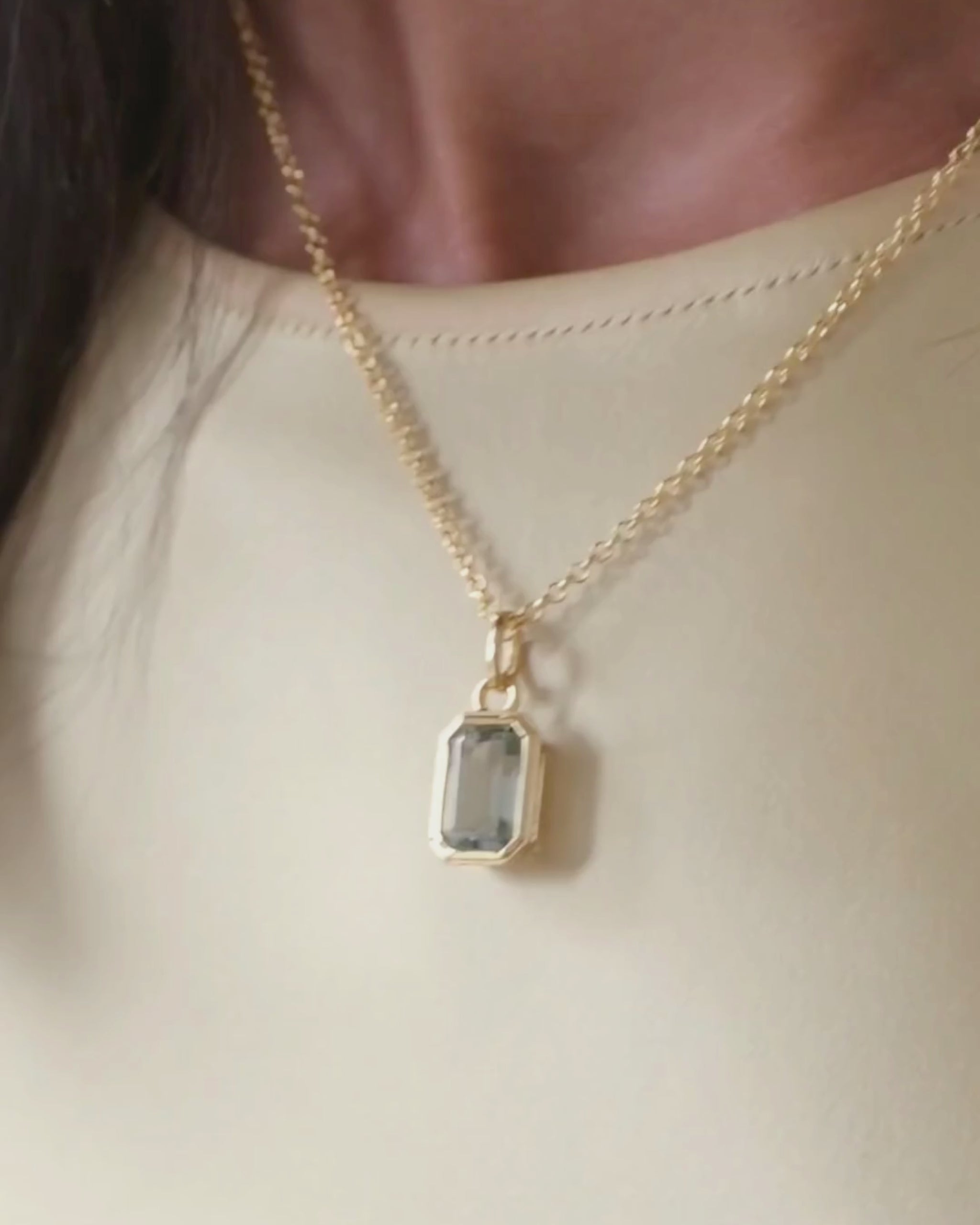 Lumi 18ct gold plated emerald cut green amethyst pendant styled on a gold chain necklace
