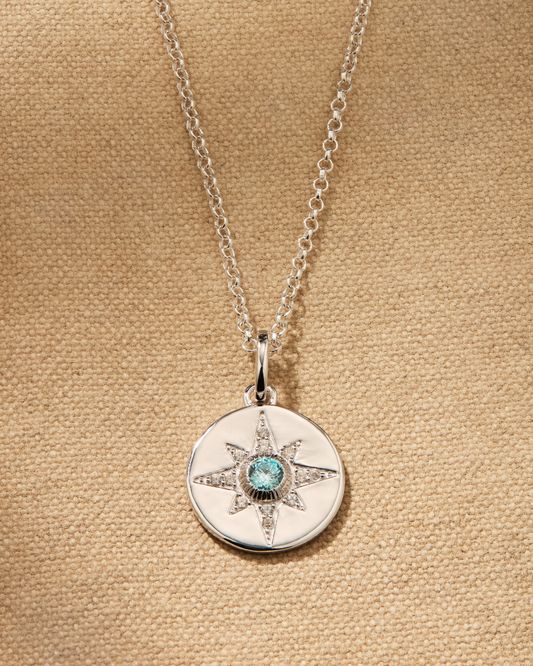 Vega disc pendant in sterling silver with star design and aquamarine crystal on Ivy fine chain necklace with adjustable length