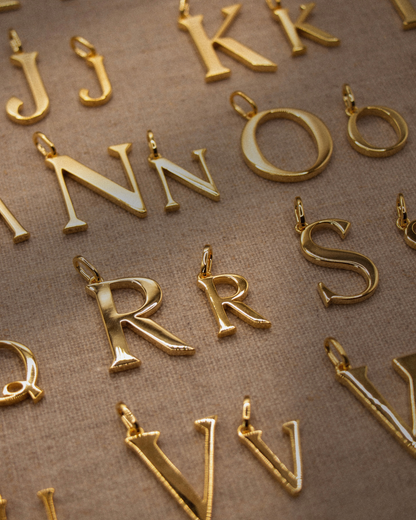 Small gold alphabet pendant initial charm in recycled sterling silver with 18ct gold plate