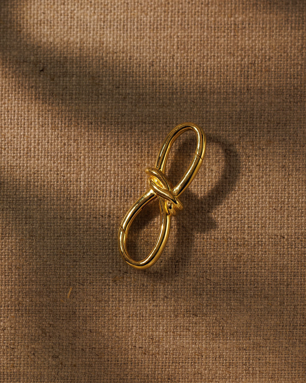 TRIXIE gold bow extender, front view